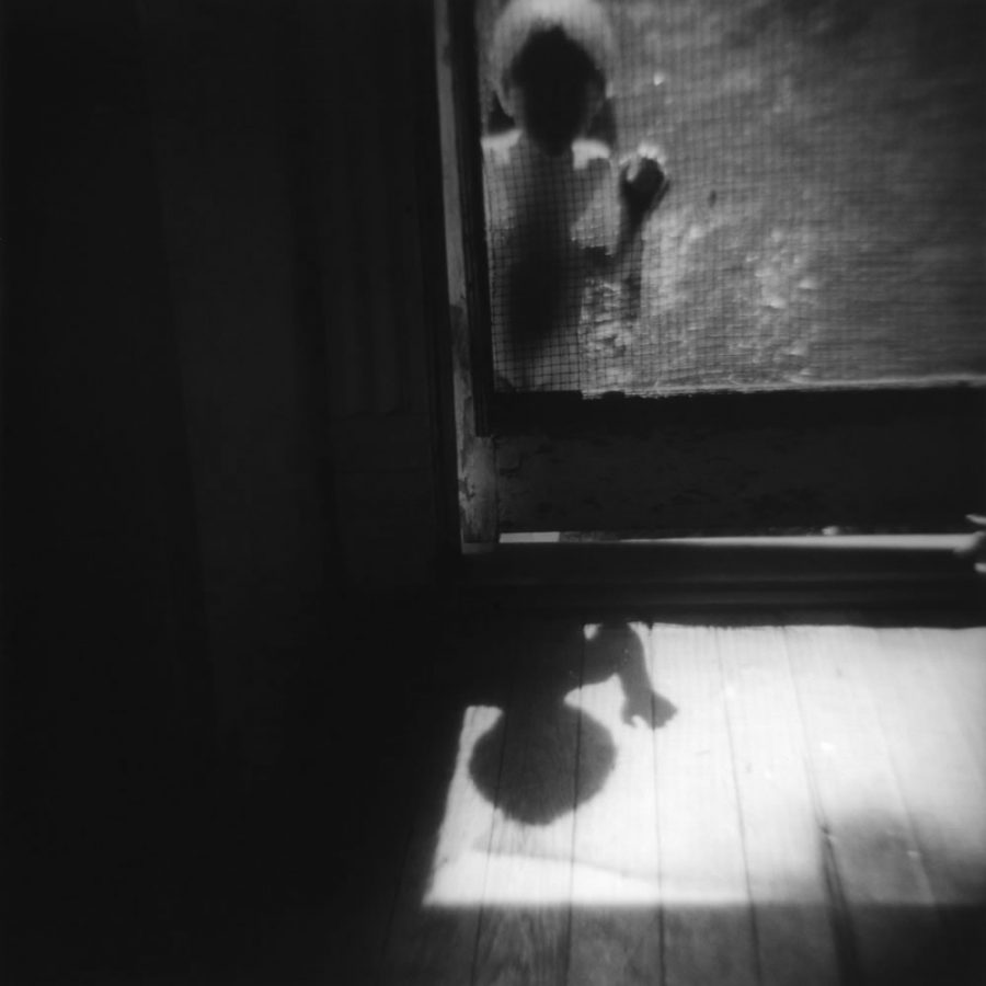 child at screen door